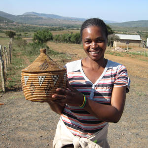 A Zulu Ilala palm basket weaver.  African basket weavers preserve their cultural heritage while they support themselves and their families.